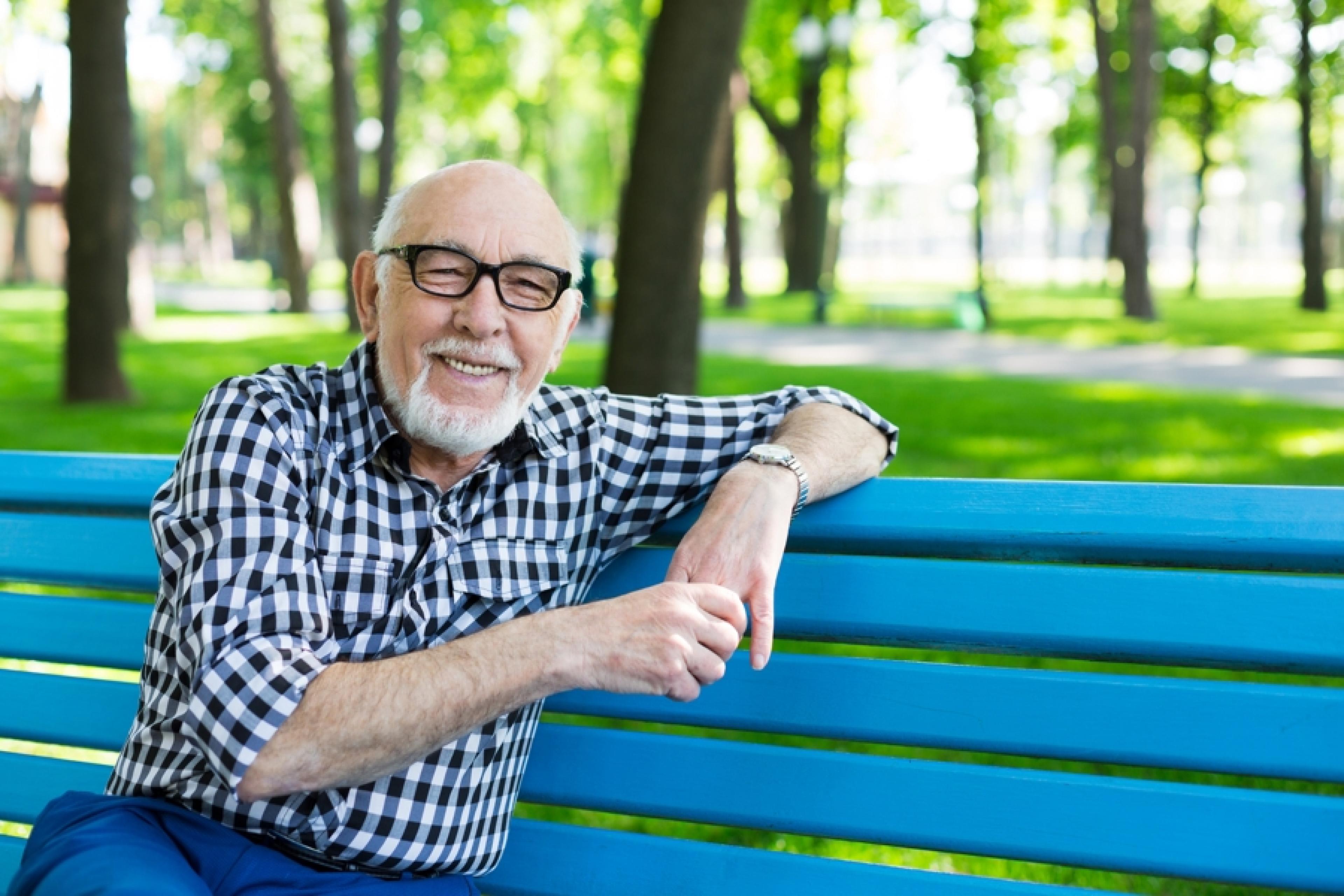 Medicare eligible man on bench in Worcester MA