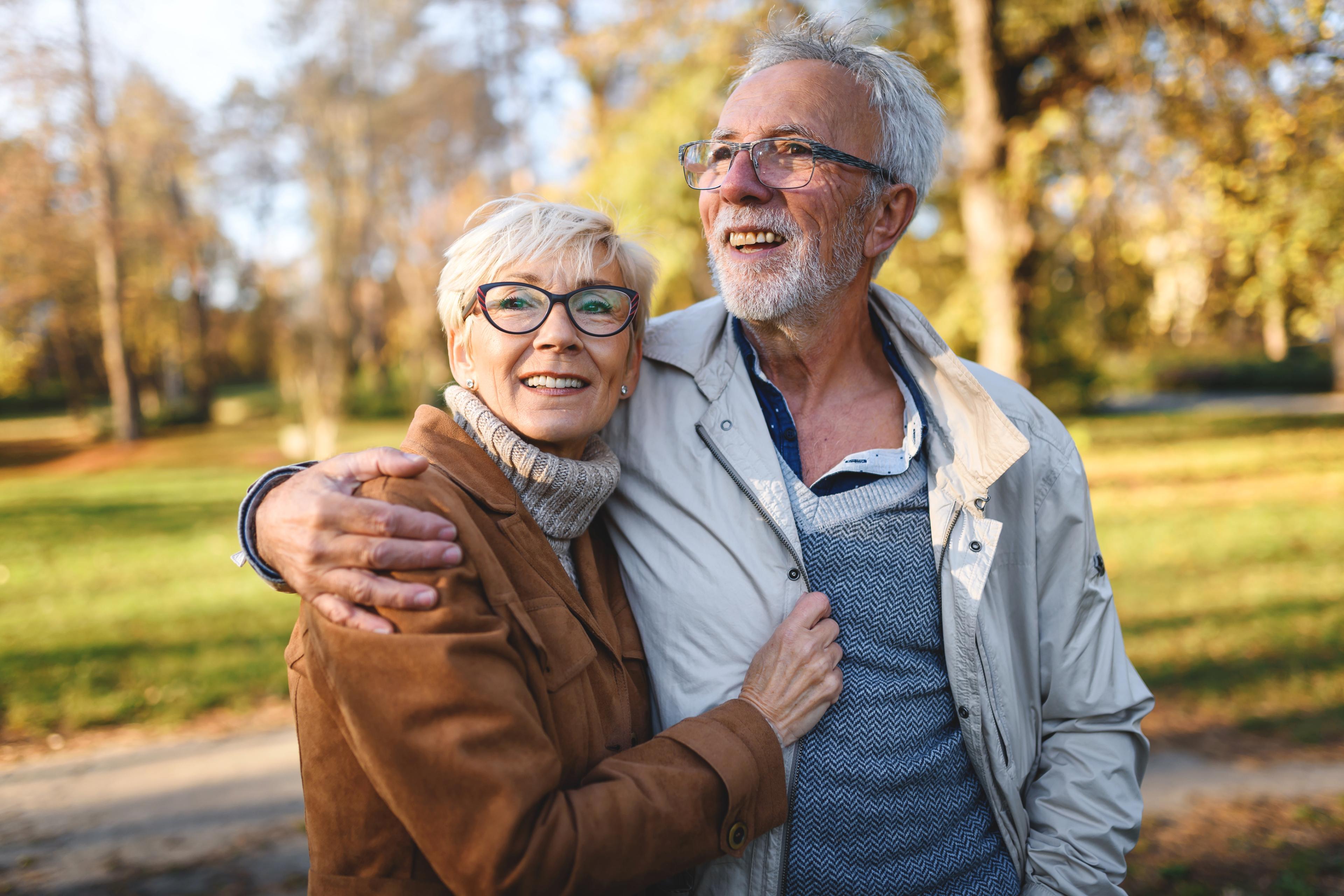 Elderly couple hugging 