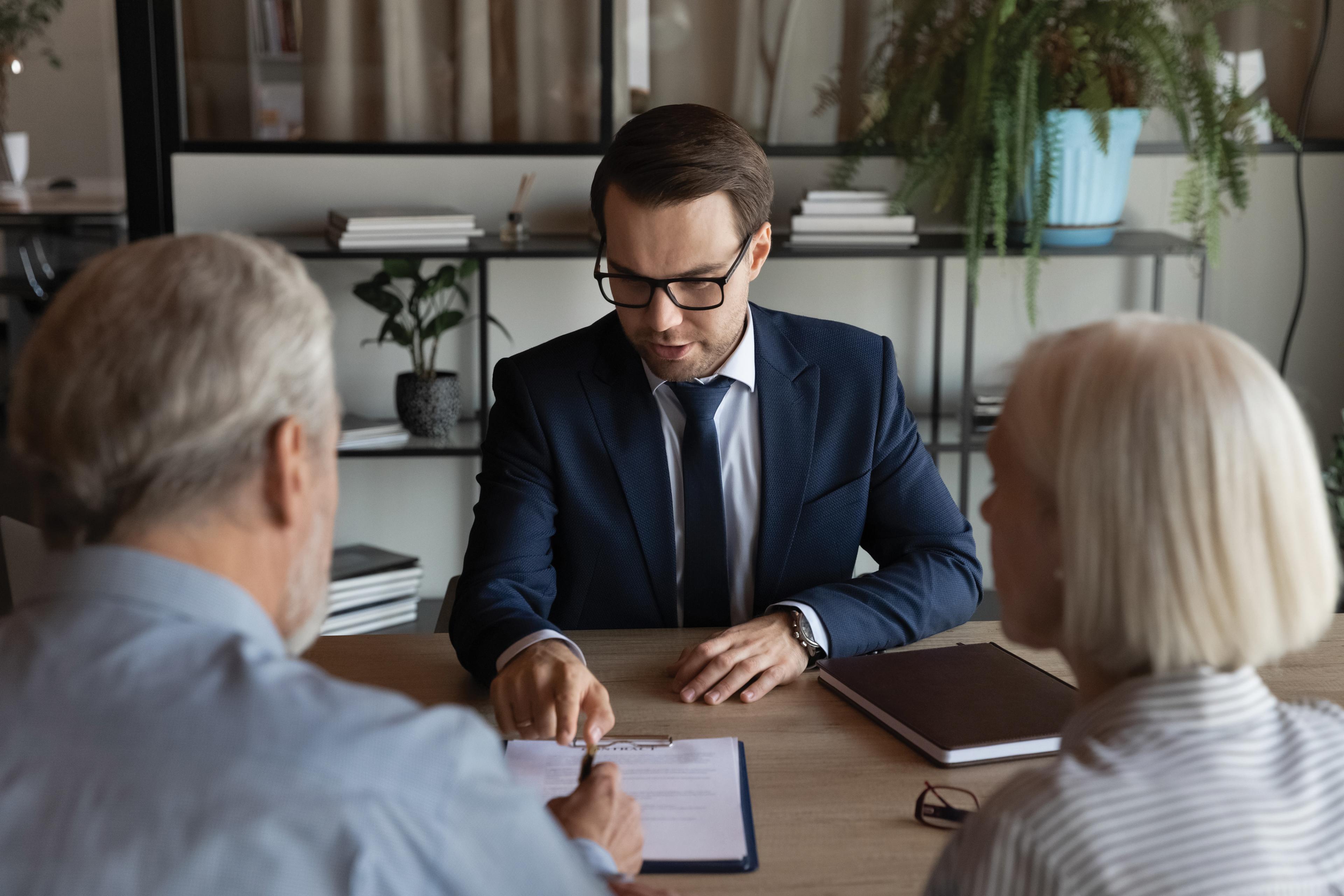 A couple is shown meeting with a Mass Advantage broker.