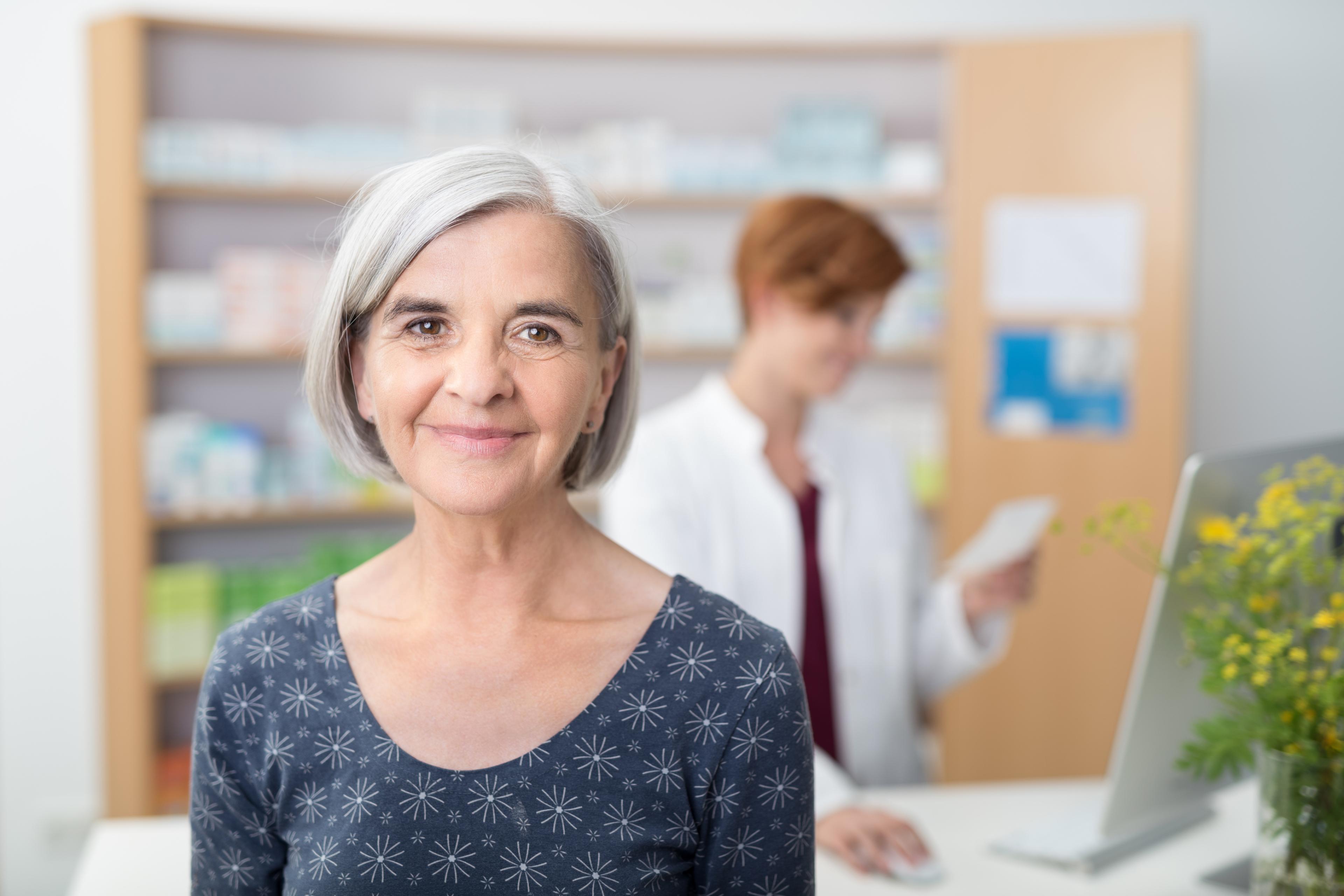 Old woman visiting pharmacy 