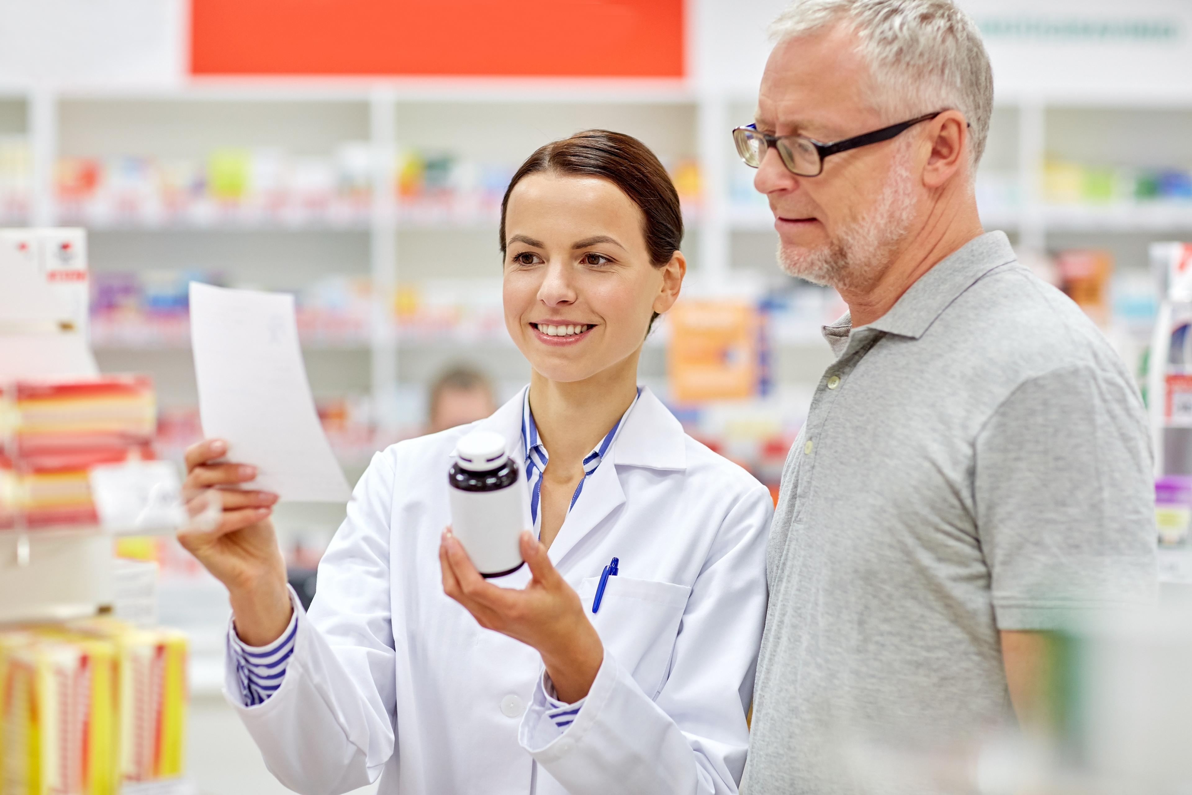 Female pharmacist with patient